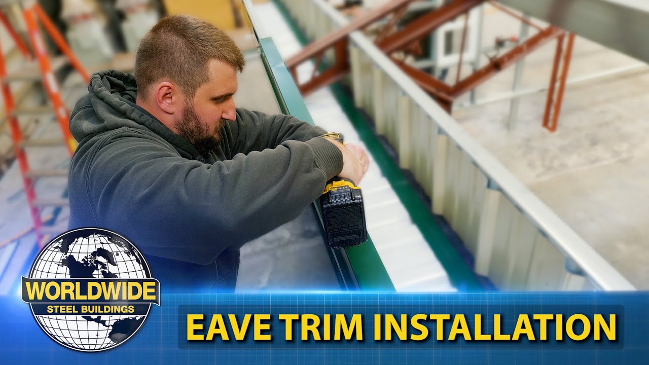 Person installing eave trim on a steel building using a power tool, with 'Worldwide Steel Buildings' logo and text 'Eave Trim Installation' displayed in the image.